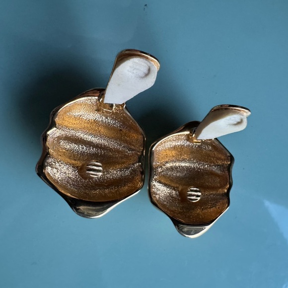 Large gold tone clip on vintage earrings